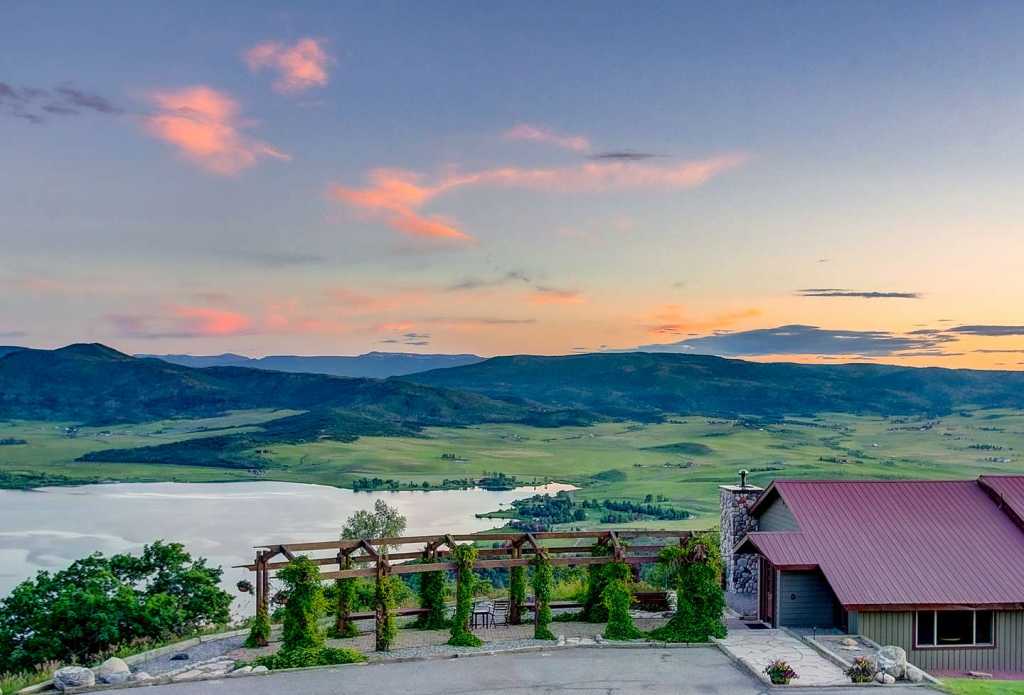 Photo of steam boat realty, landscape shot with the sunset in the background